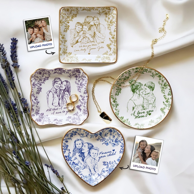 May include: A collection of personalized ceramic trinket dishes in various shapes: square, round, heart, and scalloped. Each dish features a custom family portrait and decorative floral borders. Gold rims and the text "We love you Mom", "All that I owe to you", and "Forever your child" are visible.
