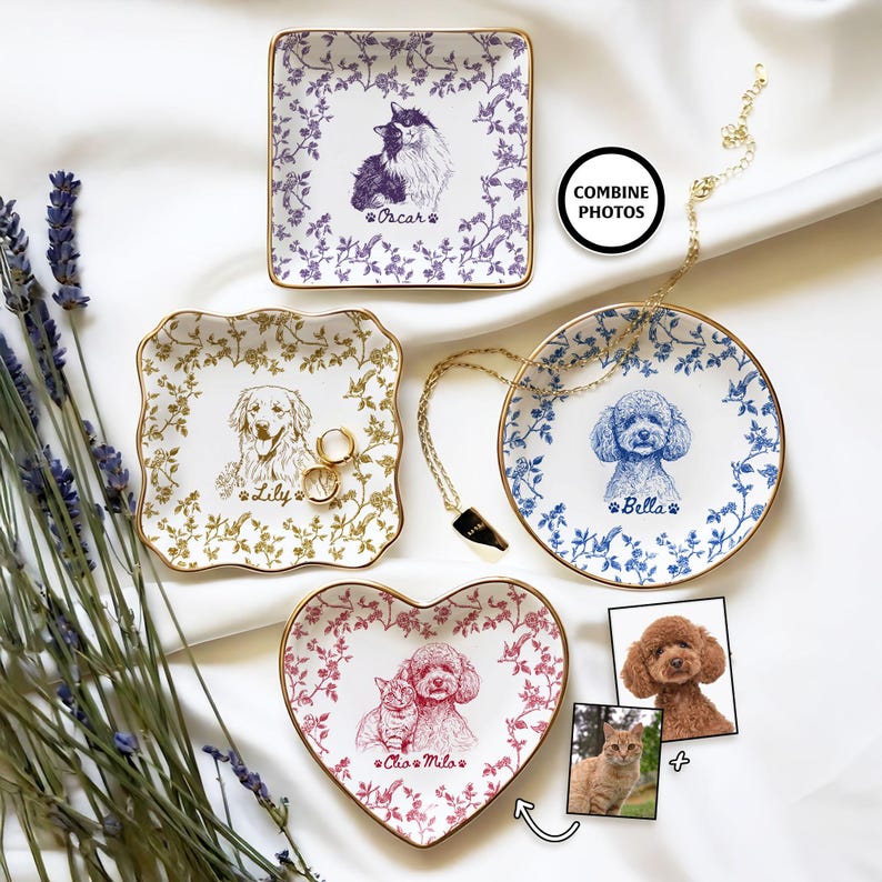May include: A collection of personalized ceramic trinket dishes with gold rims, featuring pet portraits. The dishes are square, round, and heart-shaped, adorned with floral patterns and pet names like "Oscar," "Lily," and "Bella." The image includes a necklace and two pet photos.