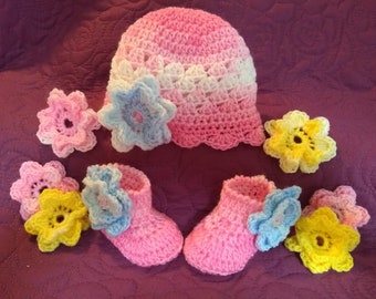 Interchangeable flower booties 18.00. Make it a flowered bootie/hat set of your choice for your infant/toddler. Smoke/pet free environment.