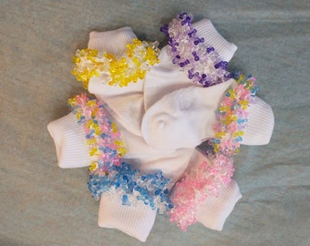 Beaded socks from 6.50/pair. Price decreases with quantity. Huge color choice. Sizes 0(NB) to 5 yrs. Made in smoke and pet free environment.