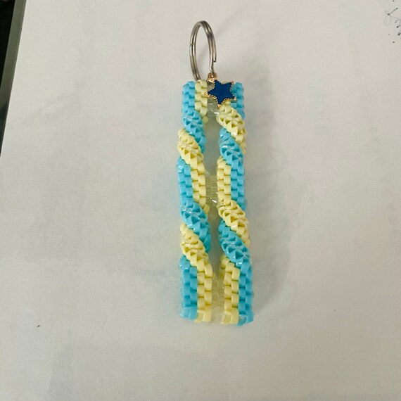 Rexlace keychain with small random charm. Custom made with Any Etsy