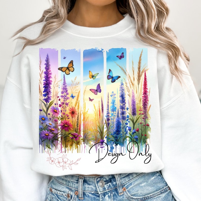 Puede incluir: Sudadera blanca con un dise&ntilde;o de acuarela de flores coloridas y mariposas. El dise&ntilde;o incluye una puesta de sol y el texto "Design Only".