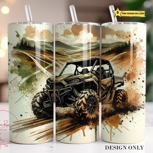 May include: A white tumbler with a watercolor design of a green and brown off-road vehicle driving through a dirt path. The design includes splashes of brown, green, and yellow paint.
