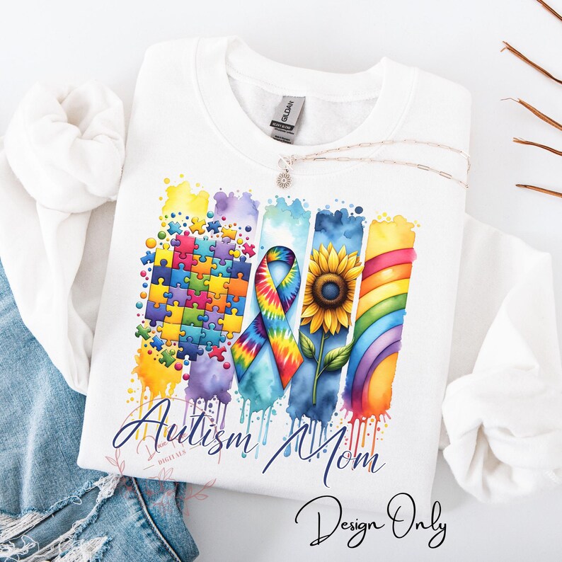 This PNG design features a vibrant and colorful composition celebrating Autism awareness. It includes a jigsaw puzzle pattern with a mix of colors, a multicolored ribbon representing autism, a bright sunflower, and a rainbow, all against a black background with watercolor splashes. The words "Autism Mom" are prominently displayed at the bottom, symbolizing support and recognition for mothers of children with autism.