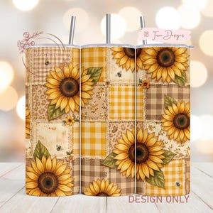 May include: A set of three stainless steel tumblers with lids and straws. Each tumbler features a patchwork design with sunflowers, bees, and floral patterns in shades of yellow, brown, and beige. The text "18 Free Designs" is visible.