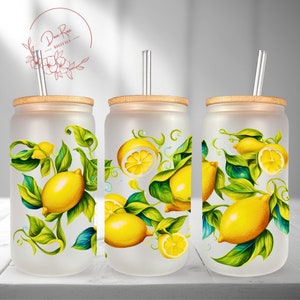 May include: Three frosted glass tumblers with bamboo lids and clear straws. Each tumbler features a lemon and leaf design with a white background.