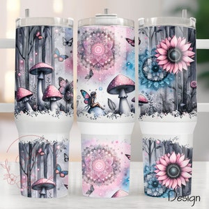 May include: Three white stainless steel tumblers with lids and handles. Each tumbler features a different design: a forest scene with mushrooms and butterflies, a mandala with pink and blue hues, and a sunflower with blue and pink accents.