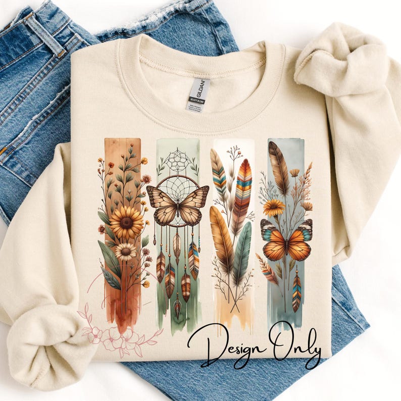May include: A beige sweatshirt with a design featuring a dreamcatcher, butterflies, feathers, and flowers in shades of brown, orange, green, and blue. The text "Design Only" is printed on the bottom of the sweatshirt.