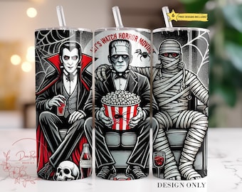 Może przedstawiać: Trzy kubki ze stali nierdzewnej w stylu horroru. Kubki przedstawiają wampira, mumię i potwora Frankensteina. Tekst na kubku brzmi "Let's Watch Horror Movies".
