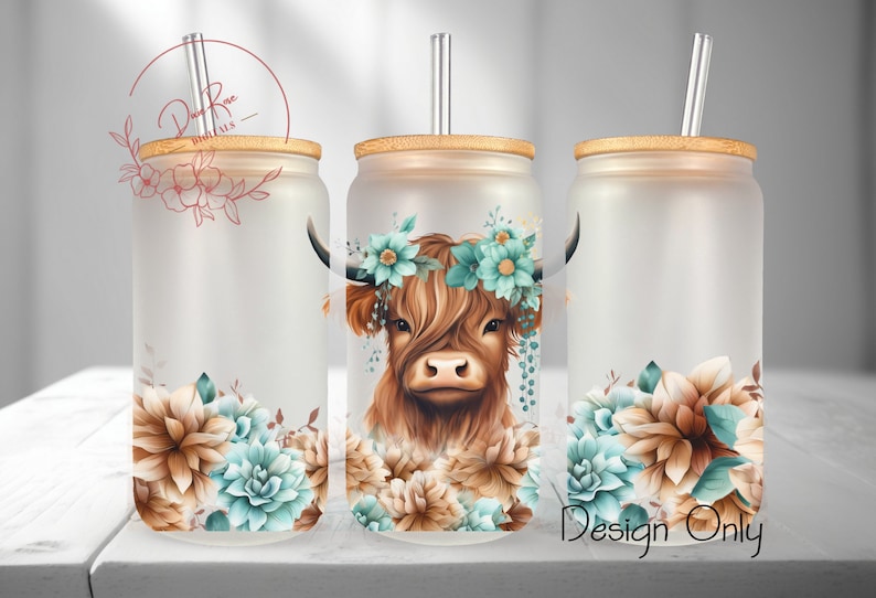 May include: Three frosted glass tumblers with bamboo lids and clear straws. Each tumbler features a floral design with a brown and white Highland cow wearing a turquoise flower crown. The text "Design Only" is visible in the bottom right corner of the image.