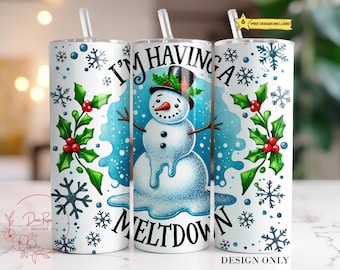 May include: A white tumbler with a snowman design and the text "I'm having a meltdown." The design includes snowflakes, holly, and a melting snowman wearing a top hat. A straw is inserted in the lid.