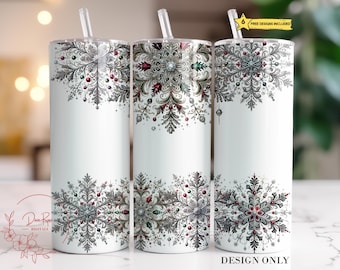 May include: Three white stainless steel tumblers with a snowflake design in shades of gray, green, and red. The tumblers are 20 ounces and have a clear lid. "Free Designs Included" is written on the top of the image.