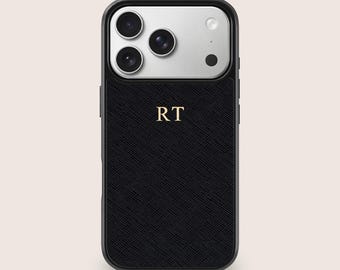 May include: Black phone case with a textured design and a silver camera panel. The case features the gold initials "RT" on the lower half. The case has a black border.