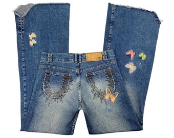 low rise jeans y2k, low rise flare jeans, flared jeans, low waisted jeans, flare denim jeans, distressed jeans, butterfly embroidered