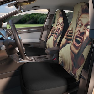 May include: Car seat covers with a digitally rendered image of a man with a shocked expression, holding up a brown object. The covers are beige with a black backing and are installed in a car interior with a black seat.
