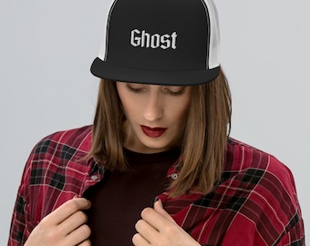 May include: A black and white trucker hat with a white embroidered "Ghost" in a gothic font.