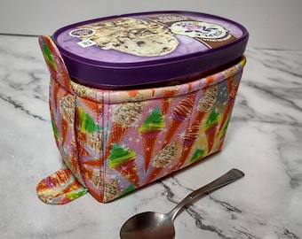 Quilted 1.5-quart size ice cream cozy. Rectangular half gallon holder with handle, easy in and out tabs. Insulate your hands from the cold.