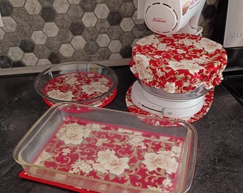 Quilted kitchen sets. Mixer mat, bowl cover, hot pads. Creamy flower on a rich red fabric print