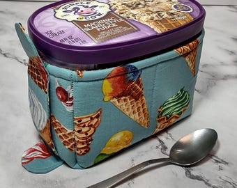 Quilted 1.5-quart size ice cream cozy. Rectangular half gallon holder with handle, easy in and out tabs. Insulate your hands from the cold.