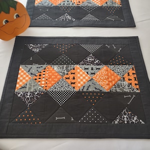 Set of 2 Quilted Halloween Placemats. Generous 14" x 18" size.  Low profile.  Not bulky. New original design. Halloween themed fabrics.