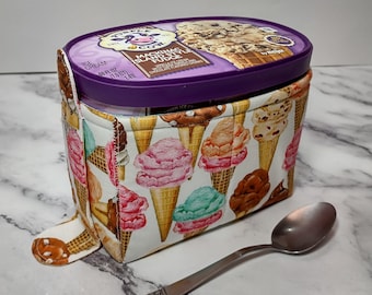 Quilted 1.5-quart size ice cream cozy. Rectangular half gallon holder with handle, easy in and out tabs. Insulate your hands from the cold.