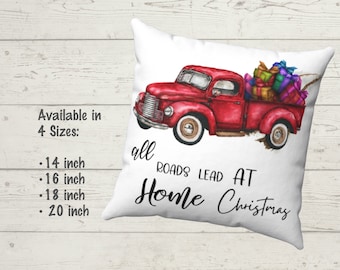 May include: A white throw pillow with a red vintage truck carrying Christmas presents. The truck is painted in watercolor style. The text on the pillow reads "all roads lead at home Christmas". Available in 4 sizes: 14 inch, 16 inch, 18 inch, and 20 inch.