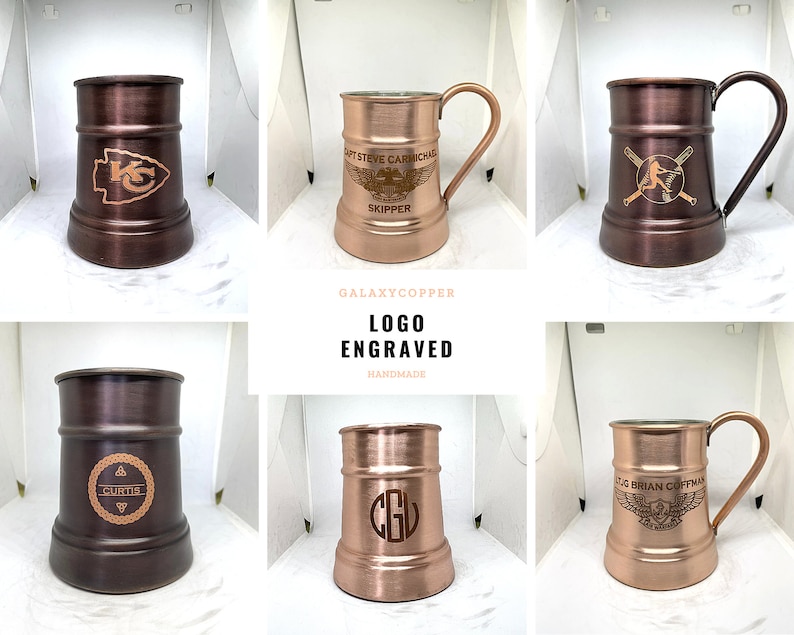 May include: Six copper mugs with different logos engraved on them. The mugs are all the same size and shape, and they have a hammered finish. The logos include a baseball player, a football team logo, a monogram, and a winged logo with text. The mugs are all on a white background.