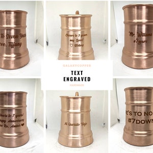 May include: Six copper mugs with personalized engravings. The mugs are all the same size and shape, with a rounded bottom and a handle. The engravings are in a variety of fonts and styles, and include messages such as "Cheers to 7 years!" and "Mr. Williams #7 years".