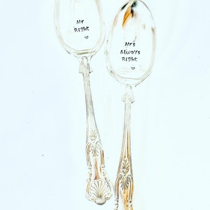 May include: Two silver spoons with engraved text. The spoon on the left says "Mr Right" with a heart symbol. The spoon on the right says "Mrs Always Right" with a heart symbol.