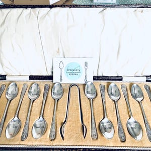 Set of 12 teaspoons with matching sugar nips