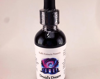 May include: A dark glass dropper bottle with a black cap and a white label. The label features the text Bodhi Extracts Presents, Druid's Dream Botanical Elixir, and a graphic illustration of a stone circle under a swirling pink and blue sky.