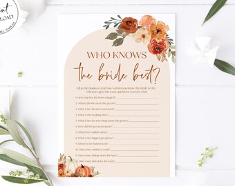 May include: A printable bridal shower game with a fall theme. The game is called "Who Knows the Bride Best?" and features a floral illustration with pumpkins and leaves in shades of orange, brown, and red. The game includes questions about the bride's preferences and experiences.