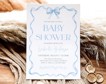 May include: A baby shower invitation with a light blue ribbon design. The invitation includes the text "PLEASE JOIN US FOR A BABY SHOWER" and details for the event, including the honoree's name, date, time, and location.