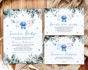 May include: A blue and white baby shower invitation with a winter theme. The invitation features a line of baby clothes hanging on a clothesline with snowflakes in the background. The text reads "Santa Baby" and includes details about the shower, including the date, time, and location. There are also two cards for "Books for Baby" and "Diaper Raffle".