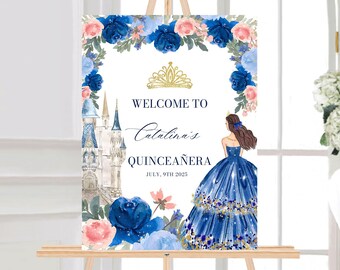 May include: A welcome sign for a Quinceañera, featuring a blue and gold castle, a princess in a blue gown, and a floral border with pink and blue roses. The text reads "Welcome to Catalina's Quinceañera July 9th 2023".