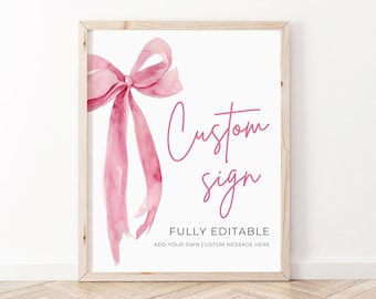 May include: A printable sign with a pink watercolor bow and the text "Custom sign" in pink script. The text "FULLY EDITABLE" and "ADD YOUR OWN CUSTOM MESSAGE HERE" is in black text.