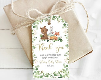 May include: Thank you tag with a green leafy border. The tag features a bear, rabbit, and fox sitting on a stack of books. The text reads "Thank you for showering our baby with love! Ellie's Baby Shower 7.27.2024"