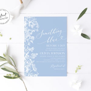 May include: A light blue bridal shower invitation with white floral illustrations and the text "Something blue" and "Before I do!"  The invitation includes the bride's name, the date and time of the shower, and the location. The invitation also includes the text "Registered at Amazon & Target".