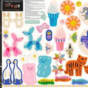 May include: A fabric sheet with various cut-and-sew designs. Includes ice cream cones, octopuses, tigers, butterflies, and balloon animals in bright colors. The text "CUT & SEW" is visible.