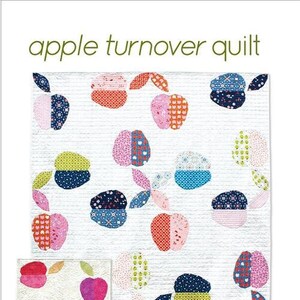 May include: A quilting pattern for an apple turnover quilt. The pattern includes instructions for four sizes: mini, runner, wall, and throw. The quilt features a white background with colorful apple designs.