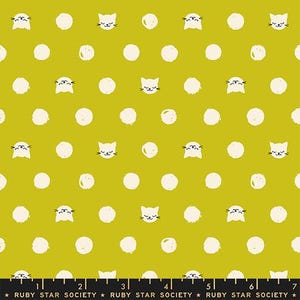 May include: A chartreuse fabric featuring a repeating pattern of white hand-drawn style polka dots and small white cat faces with black facial features. A black selvage edge at the bottom displays the text RUBY STAR SOCIETY with stars.