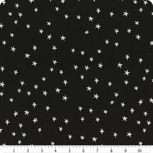 May include: Black fabric with a white star pattern. The stars are of varying sizes and are scattered randomly across the fabric.