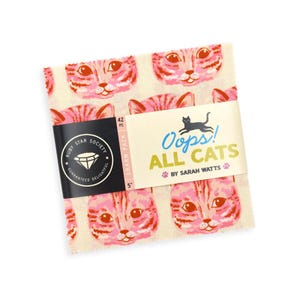 May include: A square charm pack of 42 fabric squares, each measuring 5 inches. The fabric features a repeating pattern of pink and orange cat faces on a cream background. A paper band wraps around the center with the text Oops! ALL CATS.