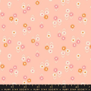 May include: A pink fabric with a repeating pattern of white and orange flowers. The flowers are arranged in a diamond pattern.