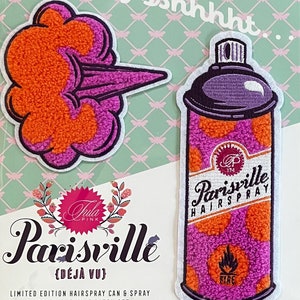 May include: A set of two pink and orange chenille patches featuring a spray can and a spray of hairspray. The patches are labeled "Parisville Hairspray" and "Déjà Vu".