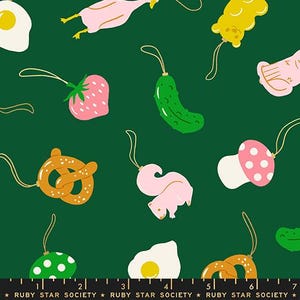 May include: A repeating pattern on a dark green background features whimsical illustrations of food and animals. The designs include a pink strawberry, a green pickle, a pretzel, a squirrel, a mushroom, and a fried egg. Each design has a gold string.
