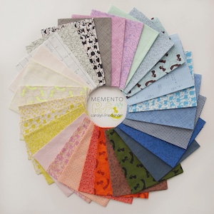 May include: A circular arrangement of fabric swatches in various colors and patterns. The fabrics include floral, geometric, and animal prints in shades of pink, yellow, blue, and green. The text "MEMENTO" and "carolyn friedlander" are in the center.
