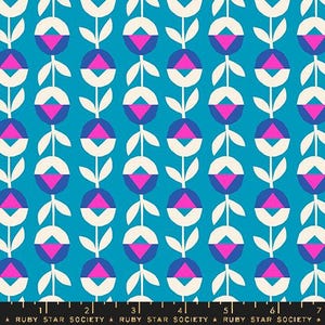 May include: A teal blue fabric with a repeating pattern of white stylized flowers with pink and blue accents. The fabric has a ruler with numbers 1 through 7 printed at the bottom.