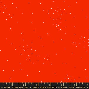 May include: Red fabric with a white polka dot pattern. The fabric has a ruler with the text "Ruby Star Society" printed on it.