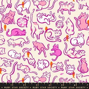 May include: A cream-colored fabric featuring a repeating pattern of cats in various poses, outlined in magenta with pink and white fill colors. Small orange fish icons are scattered throughout the design. A black ruler is visible at the bottom.